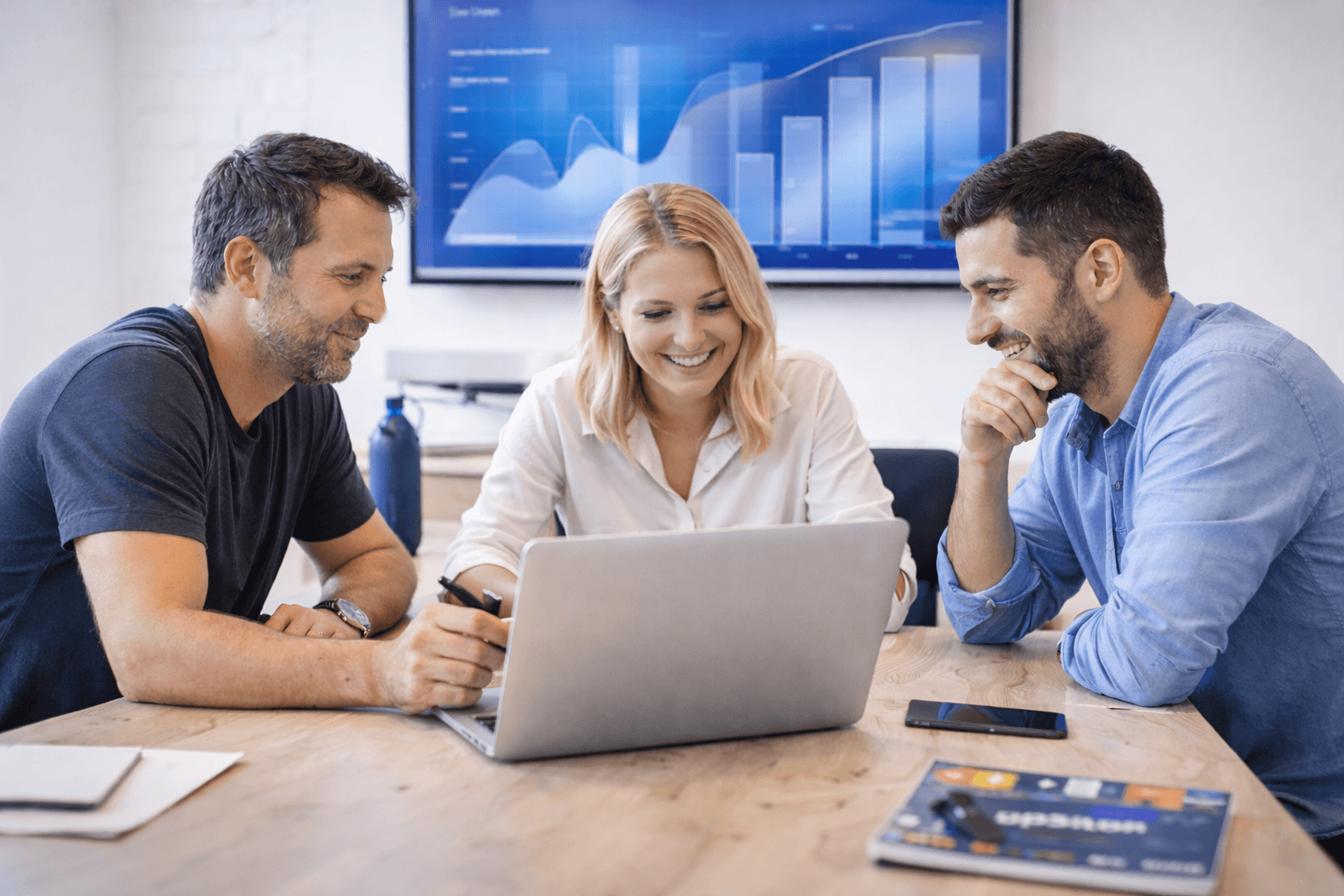 Upsilon team working in a modern studio setting